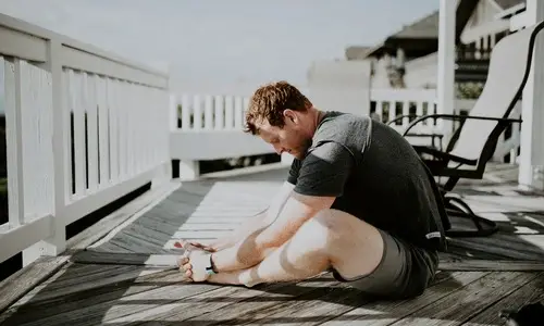 man stretching jelqing muscular